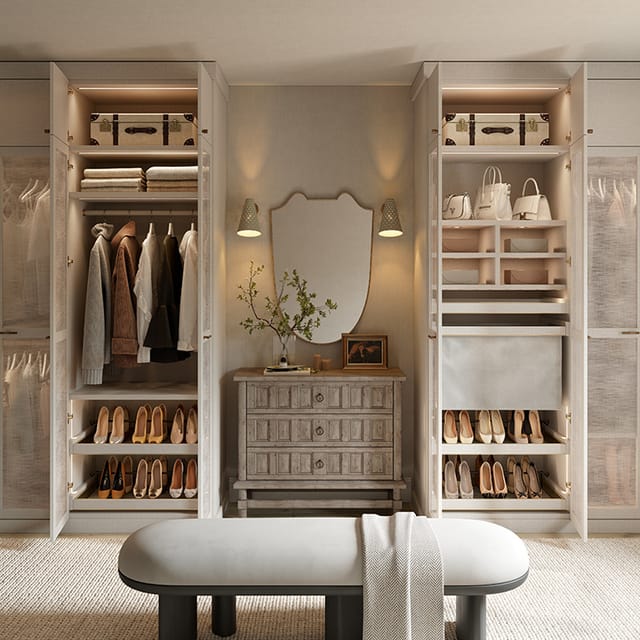 A well-organized closet showcasing shelves filled with shoes, hanging garments, storage boxes, and a central dresser topped with a decorative mirror. Handbags and neatly folded clothes are arranged on the right side.