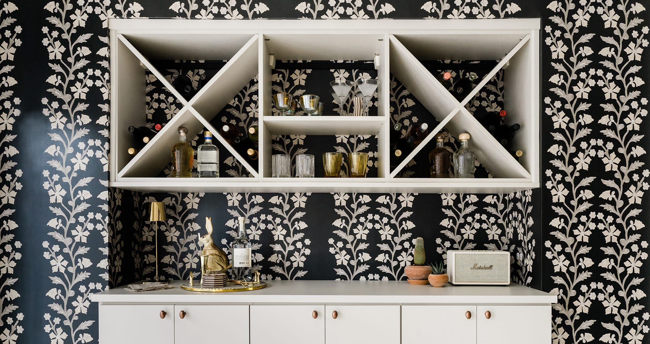 Kitchen pantry storage solution with x-cubbie wine storage and open counterspace California Closets