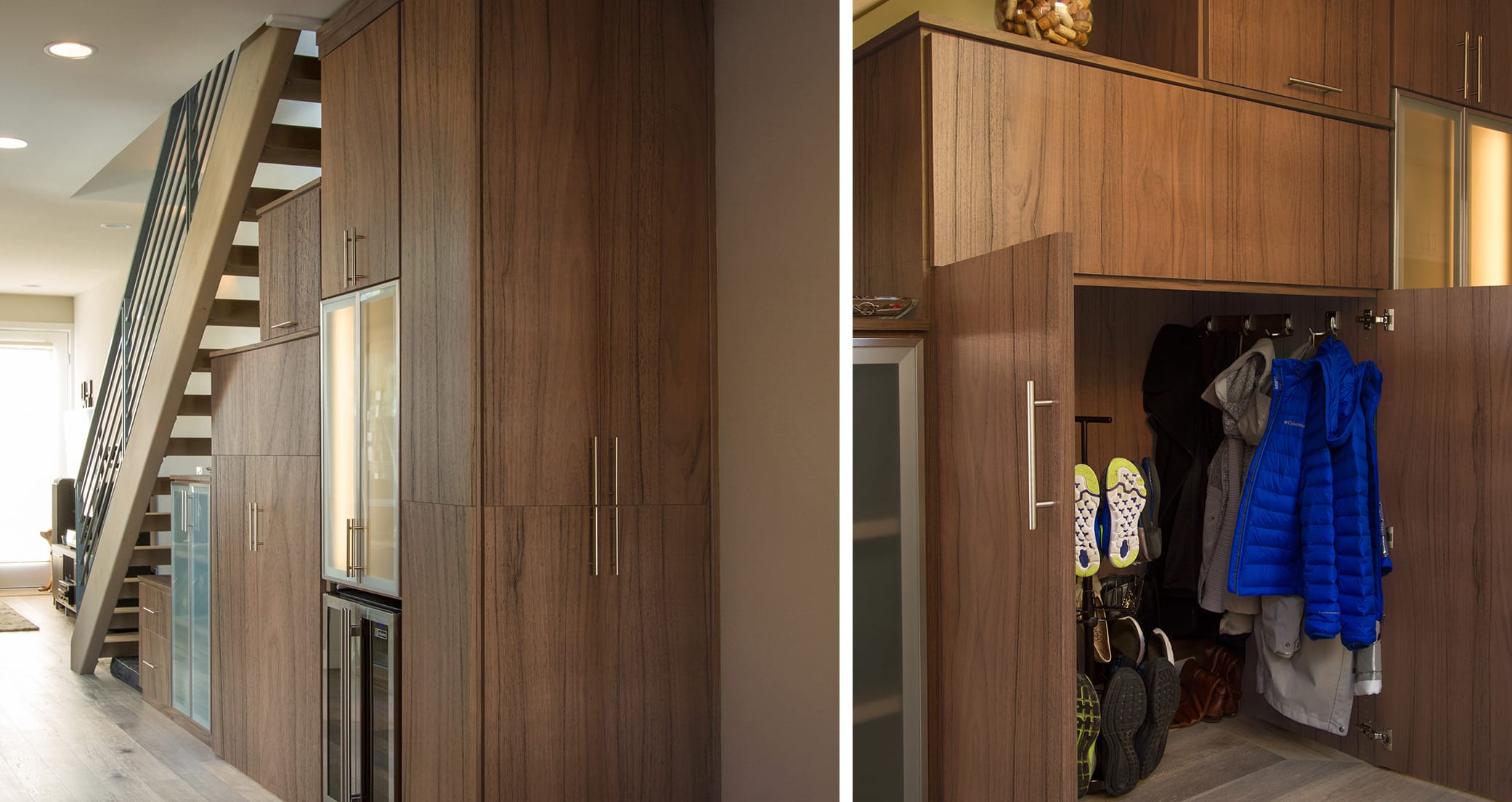 Mudroom storage designed to fit under the stairs with custom cabinets and hooks in dark wood finish by California Closets