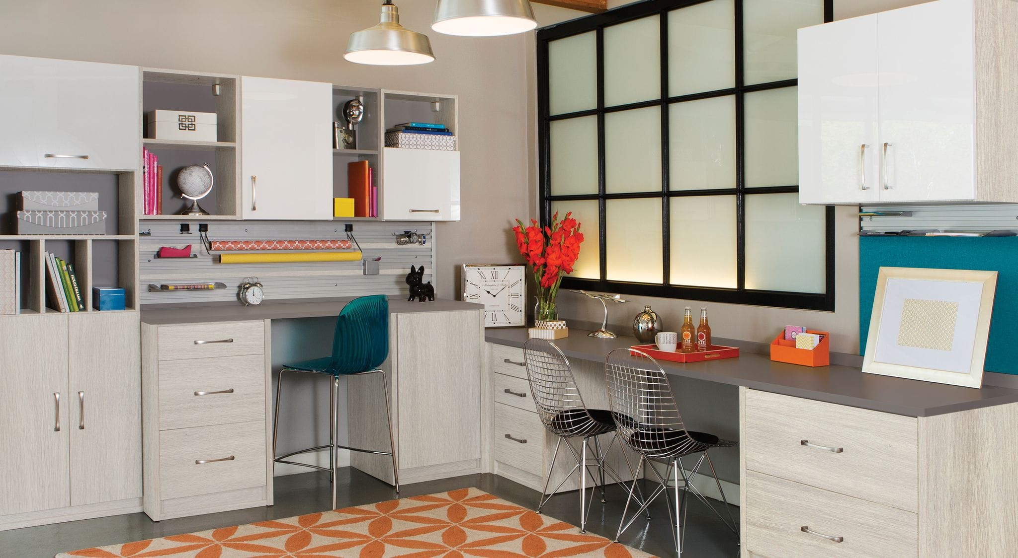 Home workspace meets craft room with extra counterspace, cubbies, shelve storage by California Closets