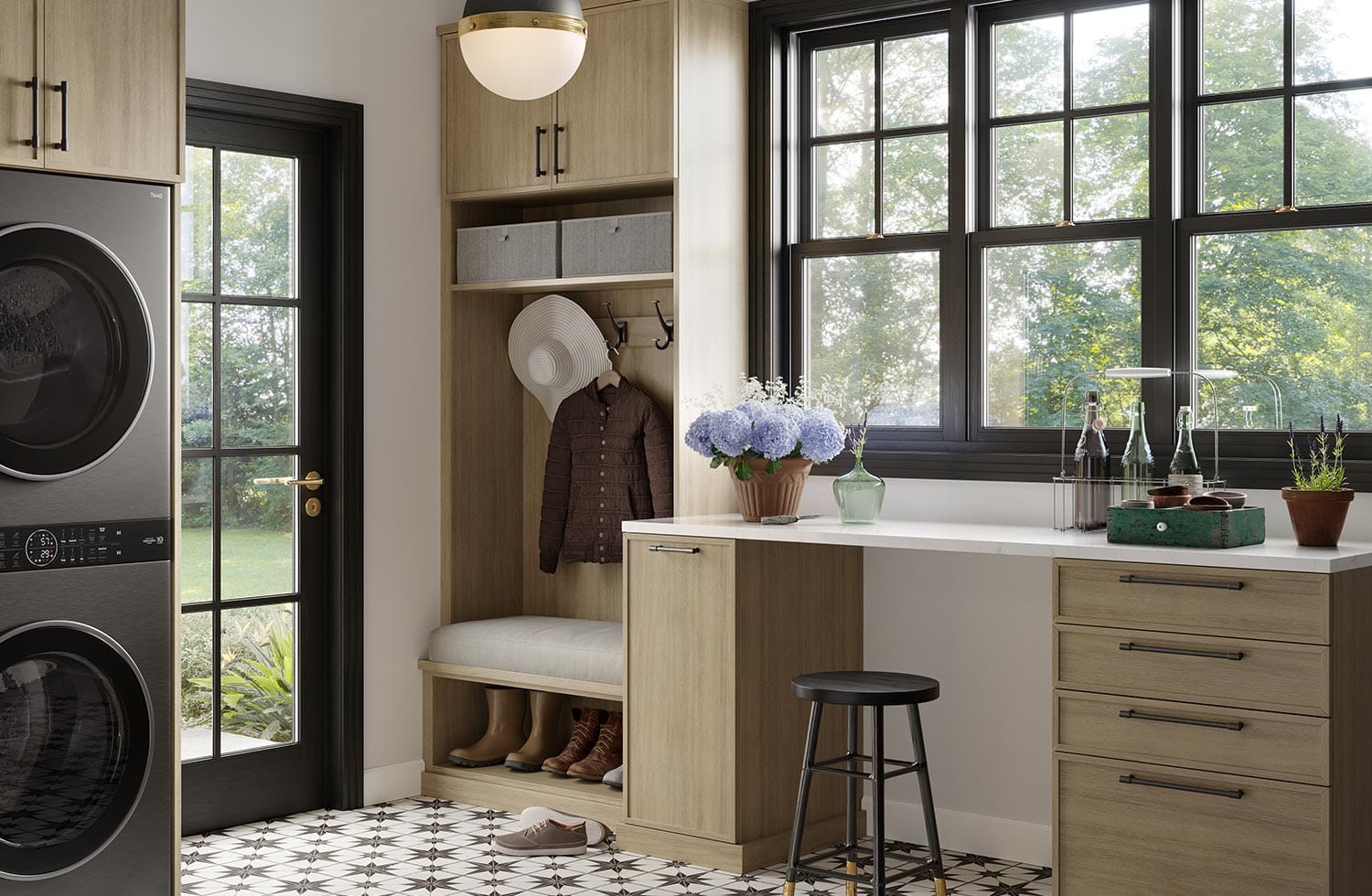 Entryway laundry room custom design with cabinets and desk by California Closets