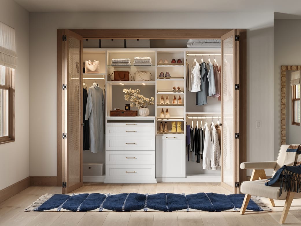 Open shelves wardrobe storage, lighting and dresser by California Closets