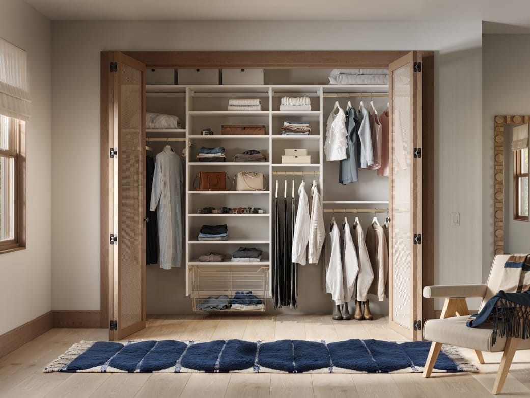 Closet drawers and open shelving storage in reach in style by California Closets