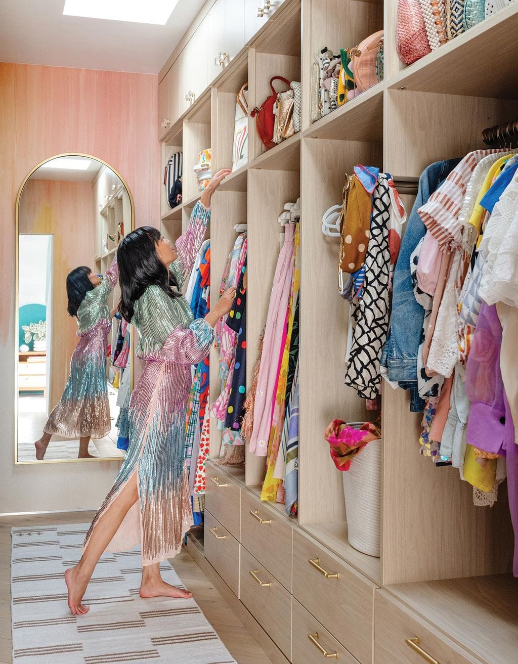 Joy Cho walk in closet design in light wood finish from California Closets