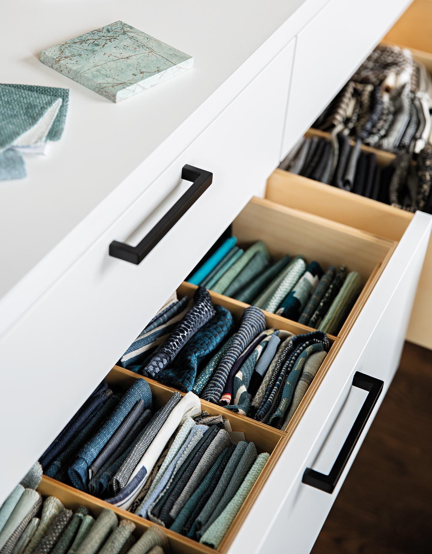 Handcrafted drawer dividers allow for the organization of every aspect Brent’s team needs to design a project in Ideas of Order Magazine