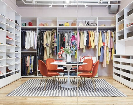 Commercial showroom custom designed with wardrobe storage shelving and cabinets by California Closets