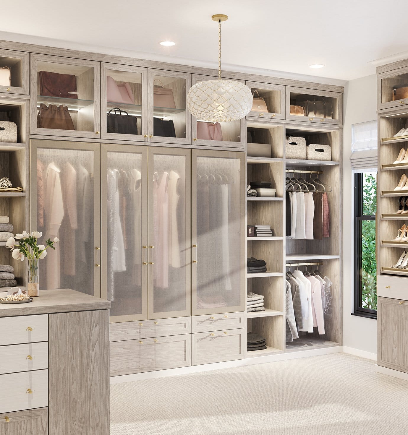 Walk in closet organization with built in pull-out shelving containing closet accessories by California Closets